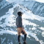 Adventurer explores snowy terrain in Ak-Talaa District, showcasing the beauty of Kyrgyzstan's winter landscape.